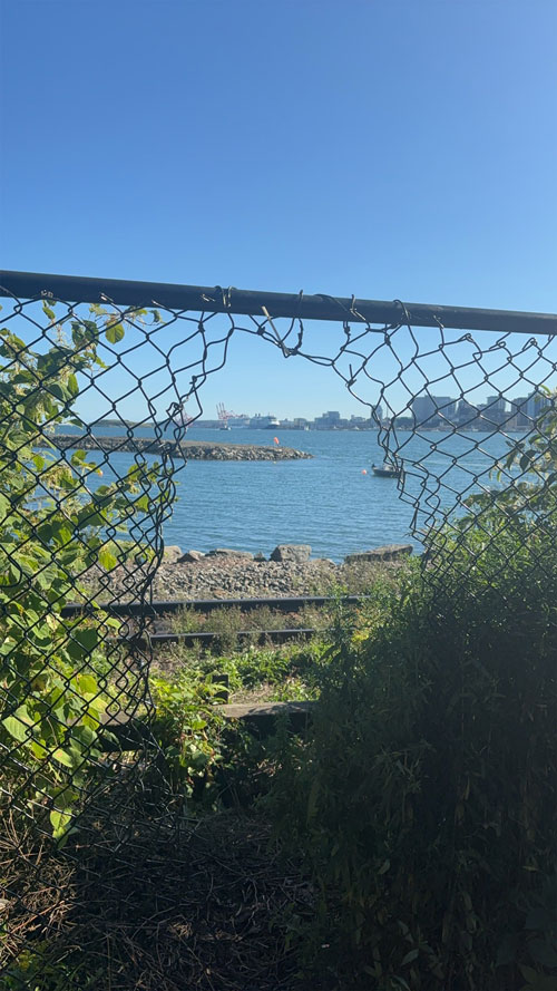 A modern building and plaza with people in front