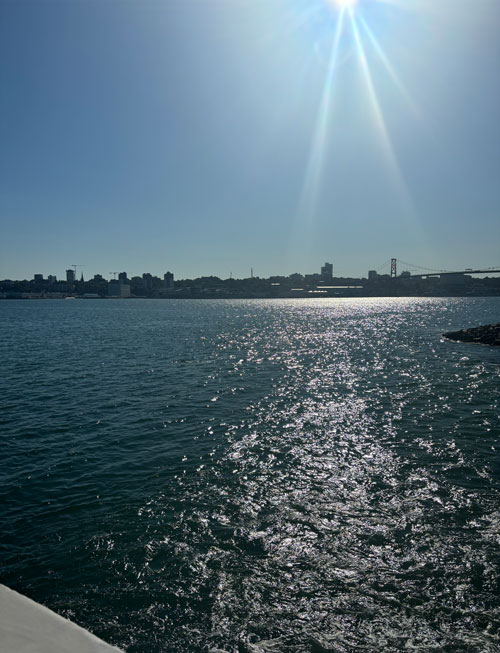 A modern building and plaza with people in front